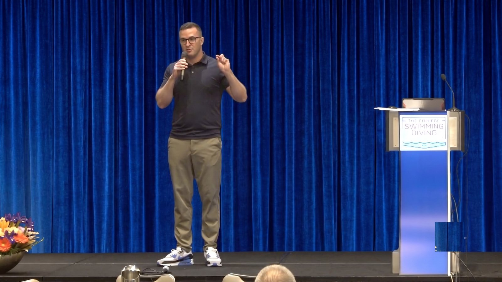 Chris speaking at a College Swimming & Diving conference